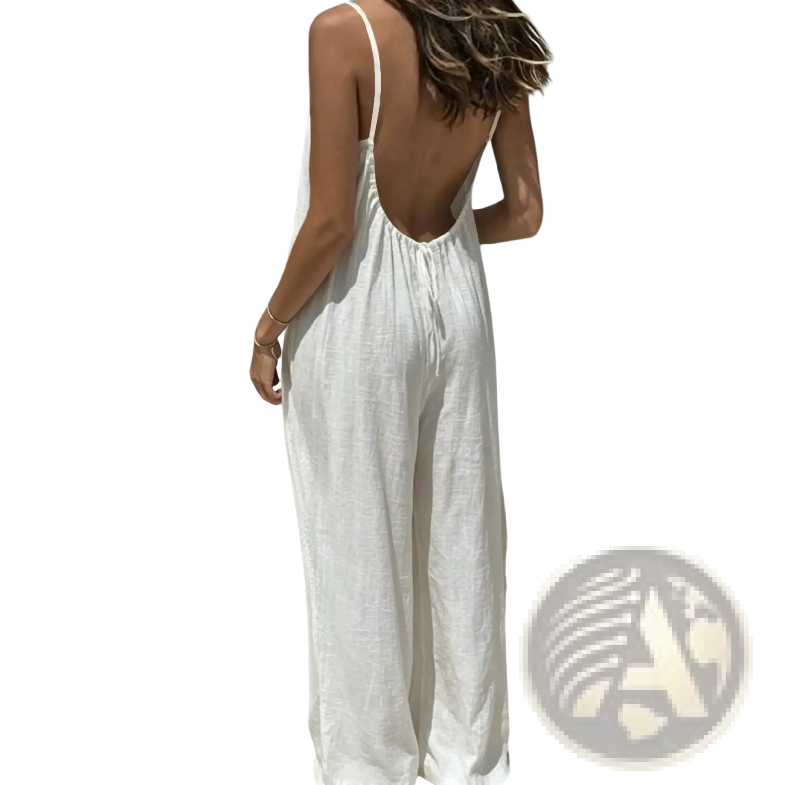 White linen wide leg backless jumpsuit with thin straps shown from the back in a breathable summer design