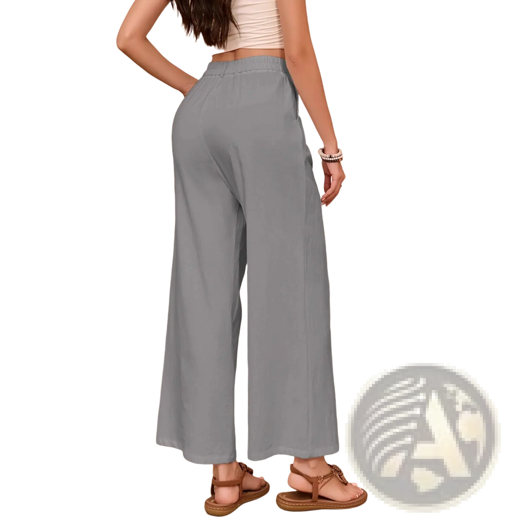Light blue linen wide leg high waisted pants with a relaxed fit and high rise for comfortable wear