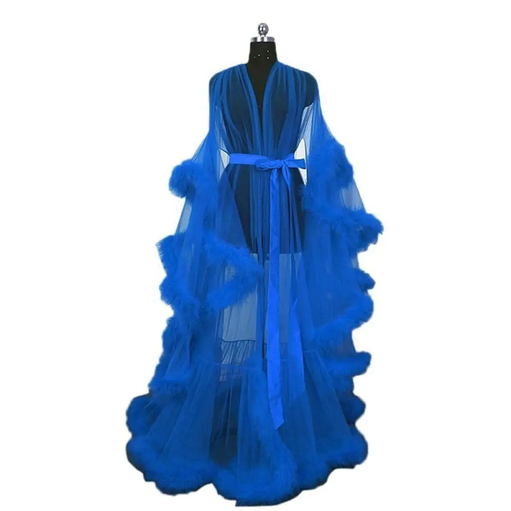 A flowing royal blue sheer tulle bridal robe with ruffled layers and matching belt luxurious for nightwear