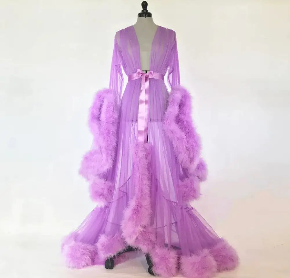 Lavender sheer tulle bridal robe with voluminous feathered trim and satin bow at the waist