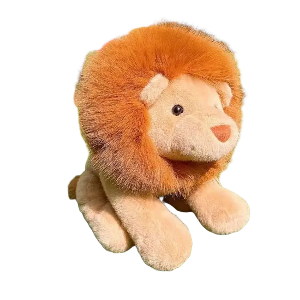 A plush orange lion stuffed animal with a fluffy mane and soft tan body sitting on green grass