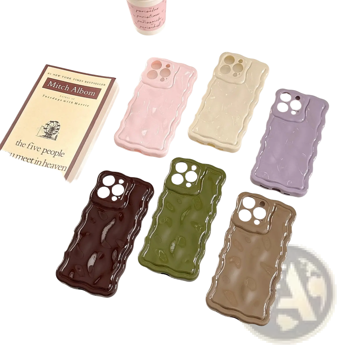 Set of six glossy liquid wave silicone iPhone cases with wavy edges in pastel pink cream lavender dark brown olive green and tan