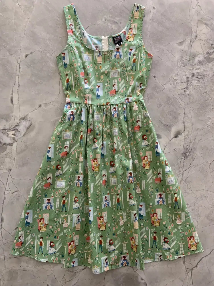 Little Women green vintage fit and flare sleeveless cotton dress with playful cartoon indoor scene pattern and pockets