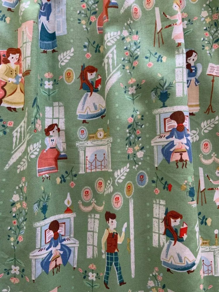 Little Women green vintage fit and flare cotton pocket dress with whimsical illustrated characters and floral motifs