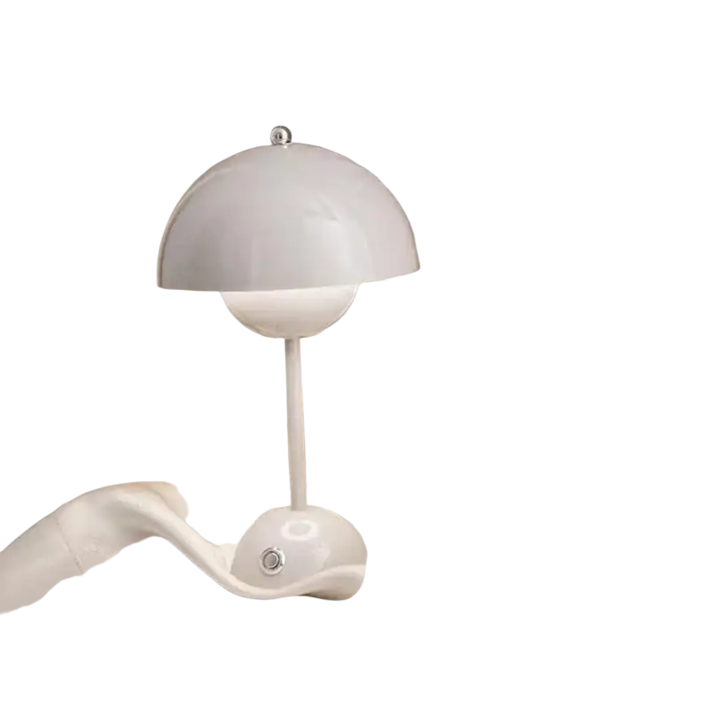 A sleek white ceramic table lamp with a flower-like dome design complements living room curtains para la sala