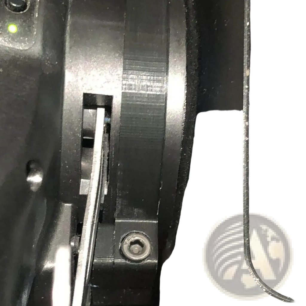 Logitech magnetic paddle shifter mod G29 G920 G923 featuring a black plastic gear with a silver metal shaft inserted