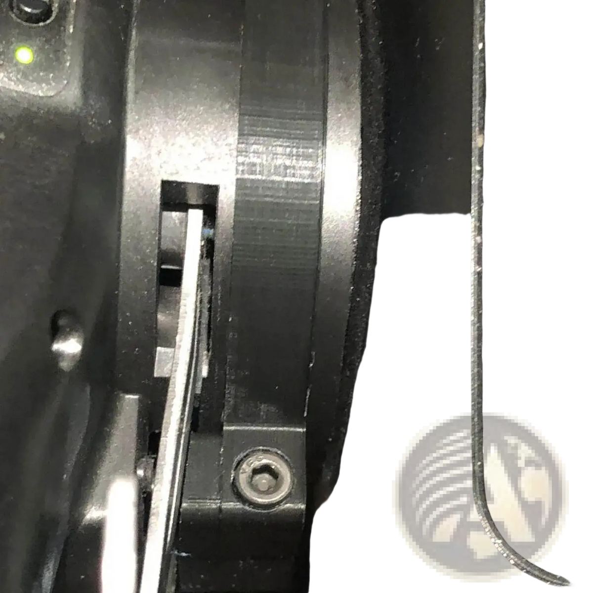 Logitech magnetic paddle shifter mod G29 G920 G923 featuring a black plastic gear with a silver metal shaft inserted