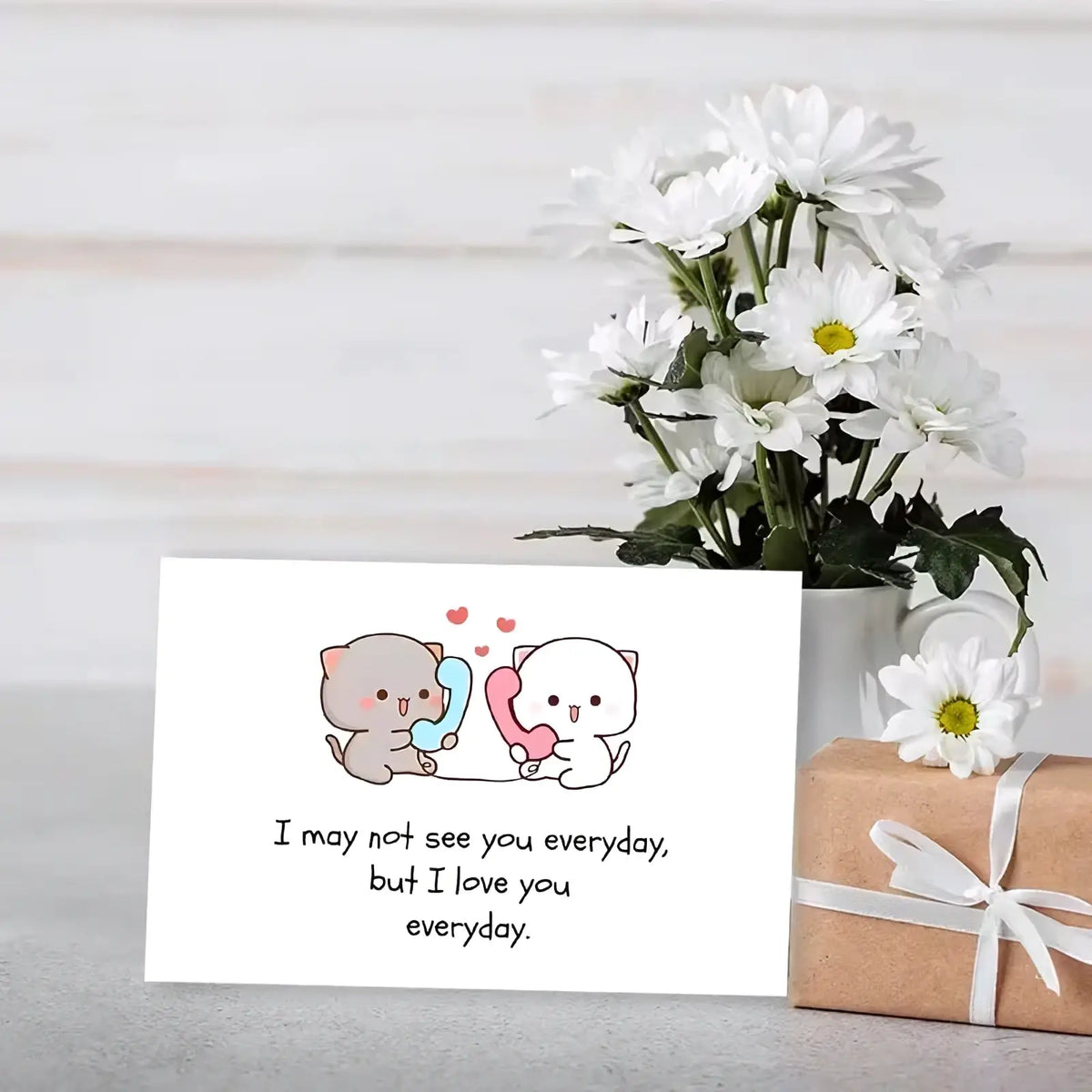 White rectangular long distance cat couple greeting card with cute cartoon cats holding colorful phones and loving text