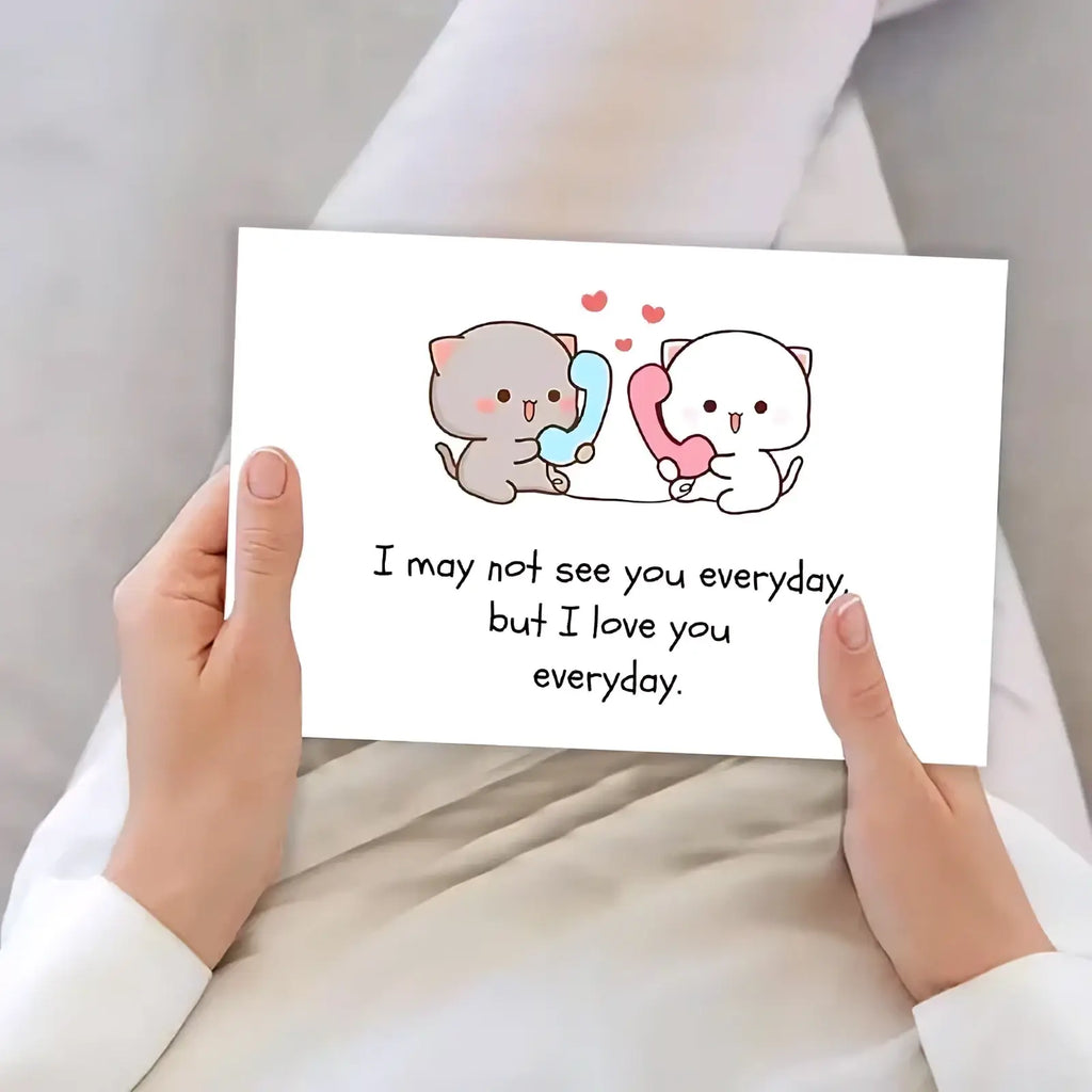 A white rectangular long distance cat couple greeting card with cartoon cats holding colorful phones and loving text