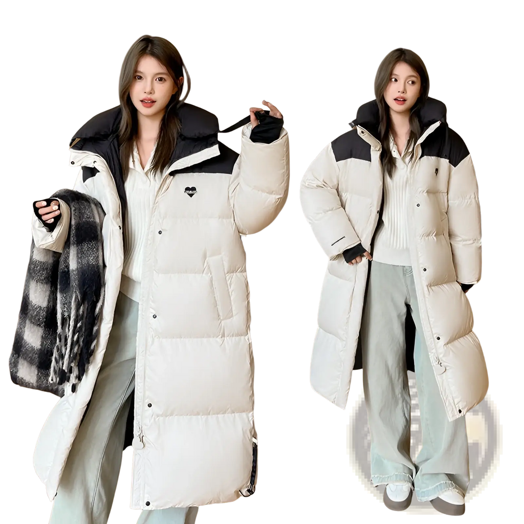Cream-colored long down puffer coat with black accents featuring a heart-shaped logo on the chest