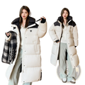 Cream-colored long down puffer coat with black accents featuring a heart-shaped logo on the chest