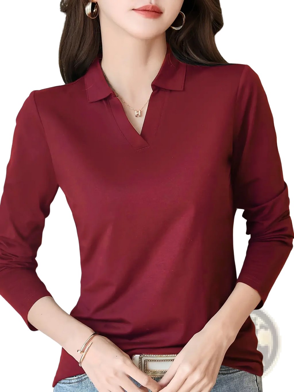 A sleek deep red long sleeve knit polo shirt for women with a classic collar and subtle sheen
