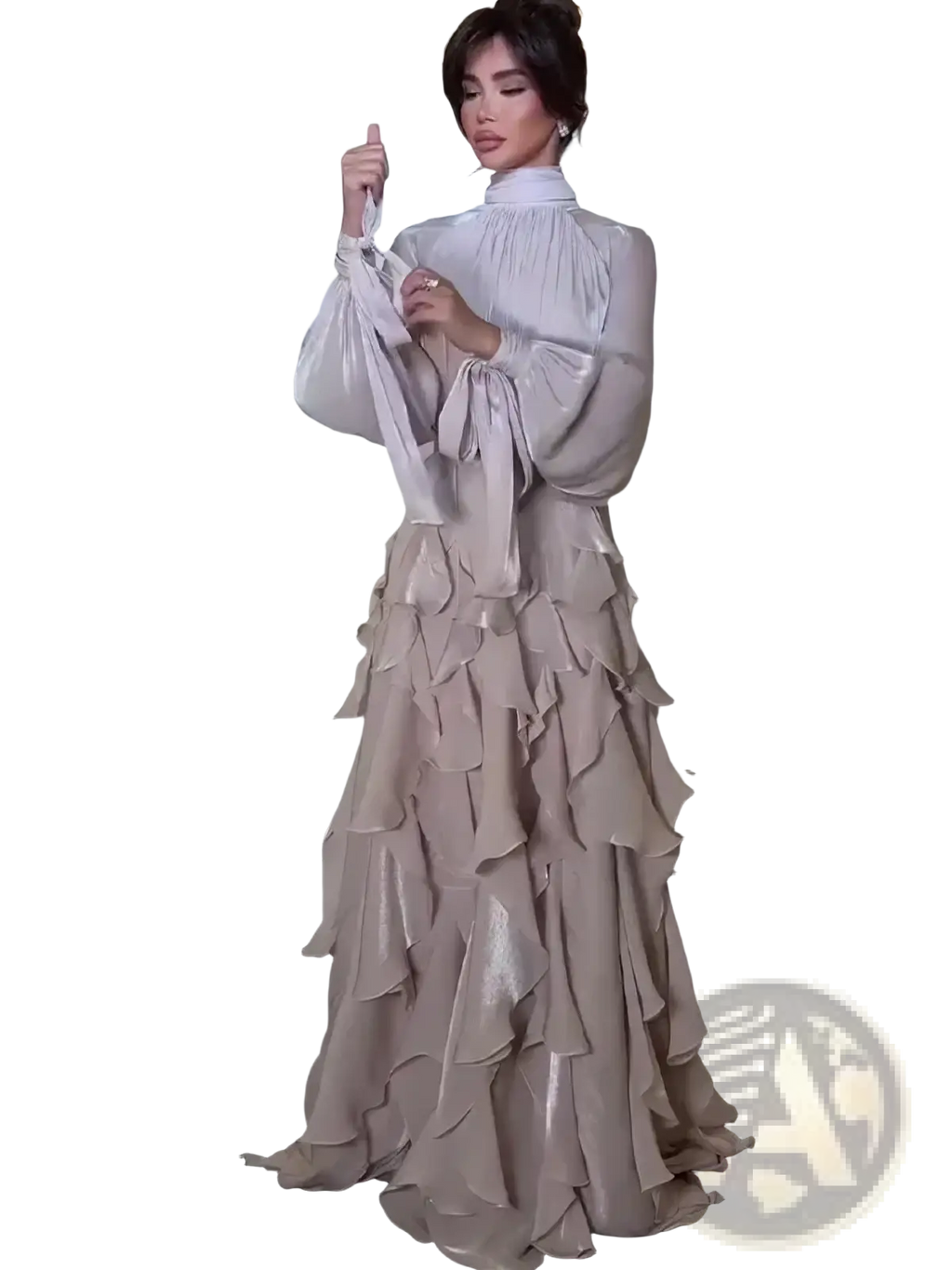 A flowing champagne-colored long sleeve satin evening dress with tiered ruffles and a high neckline