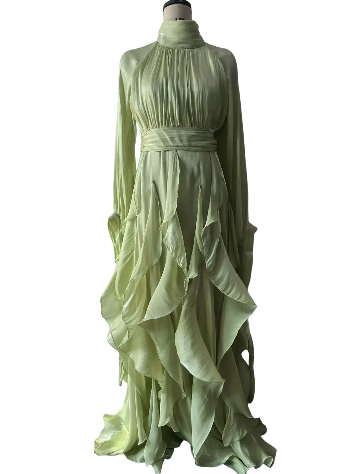 A flowing pale green silk long sleeve satin evening dress with high neckline and layered ruffles