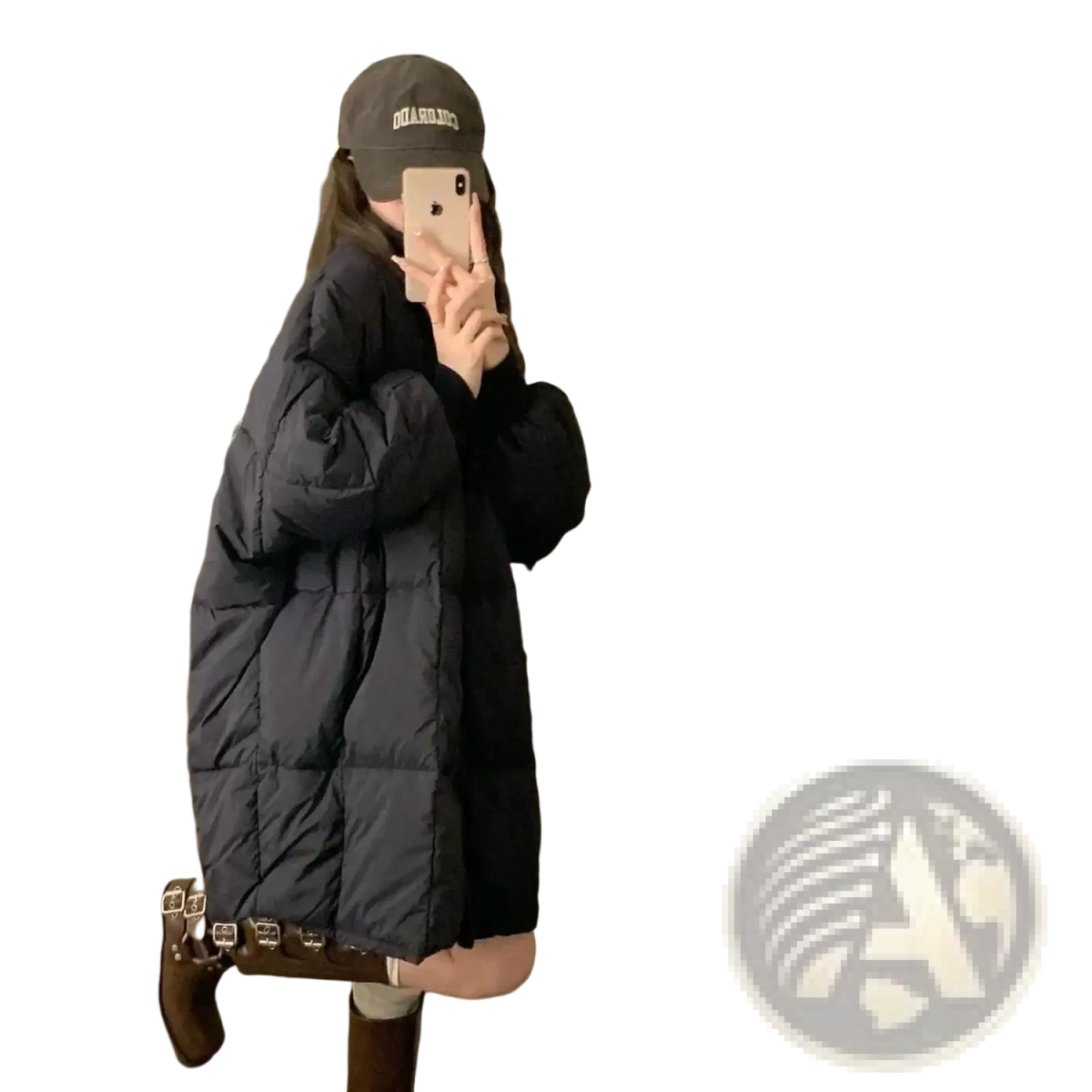 Long winter puffer coat for women in black quilted material with a long oversized silhouette and visible stitching patterns