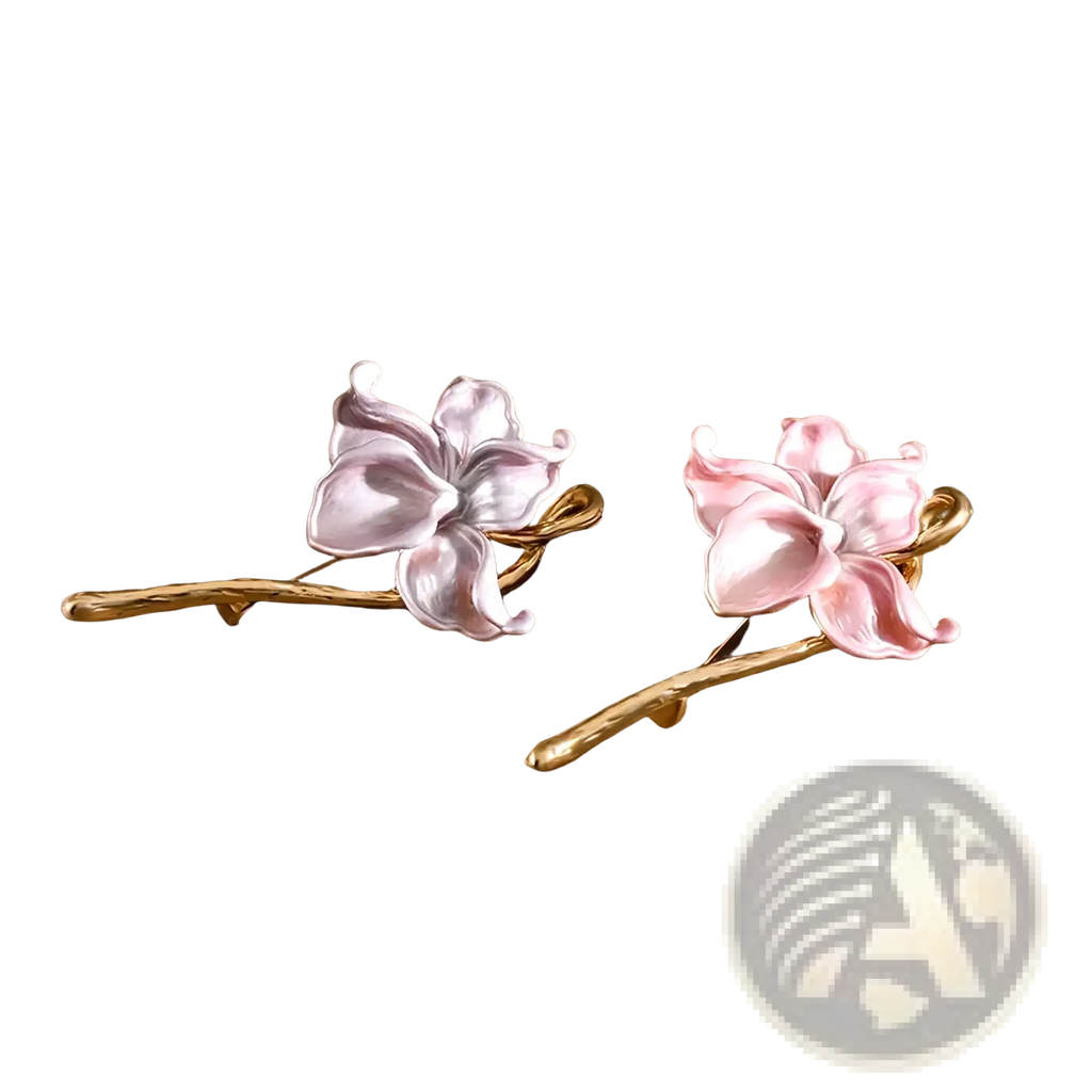 A pair of delicate floral hairpins featuring hand-painted pink and lavender enamel lotus blossoms with gold-toned stems
