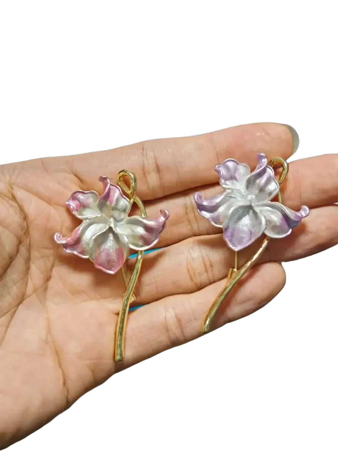 A pair of gold-toned lotus flower enamel earrings with translucent pink and lavender petals