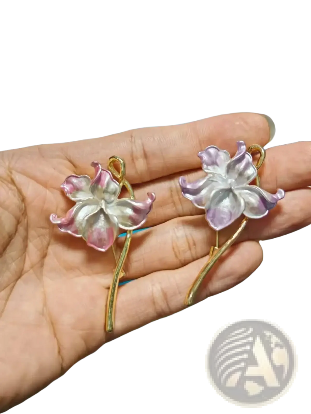 A pair of gold-toned lotus flower enamel earrings with translucent pink and lavender petals