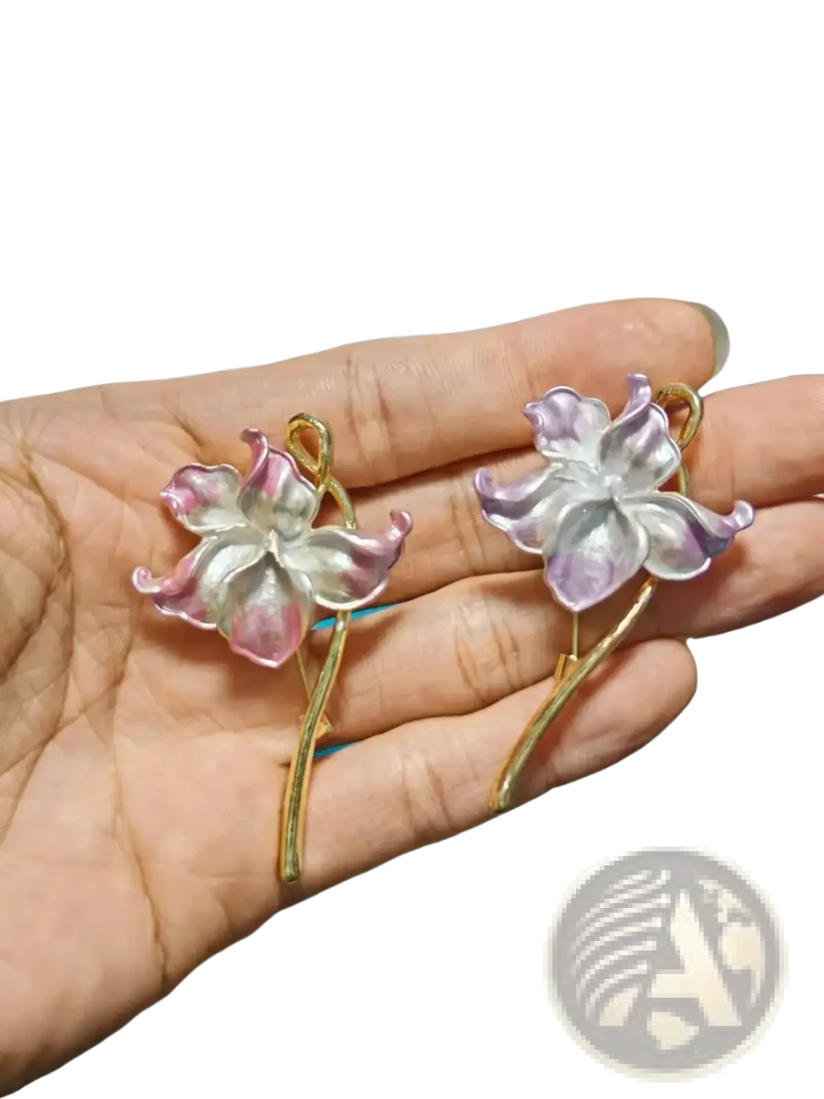 A pair of gold-toned lotus flower enamel earrings with translucent pink and lavender petals