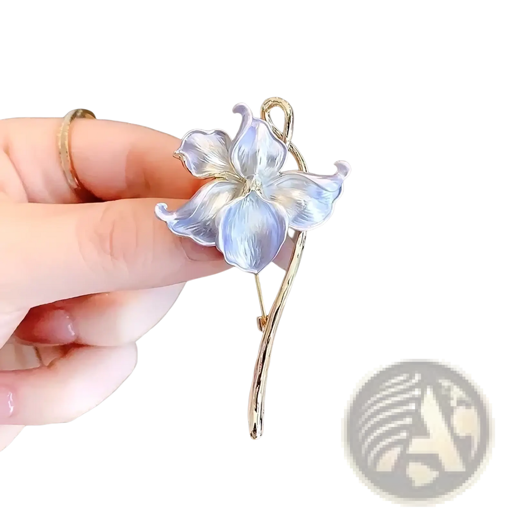Lotus flower enamel brooch pin with delicate light blue translucent petals and gold-toned stem and pin