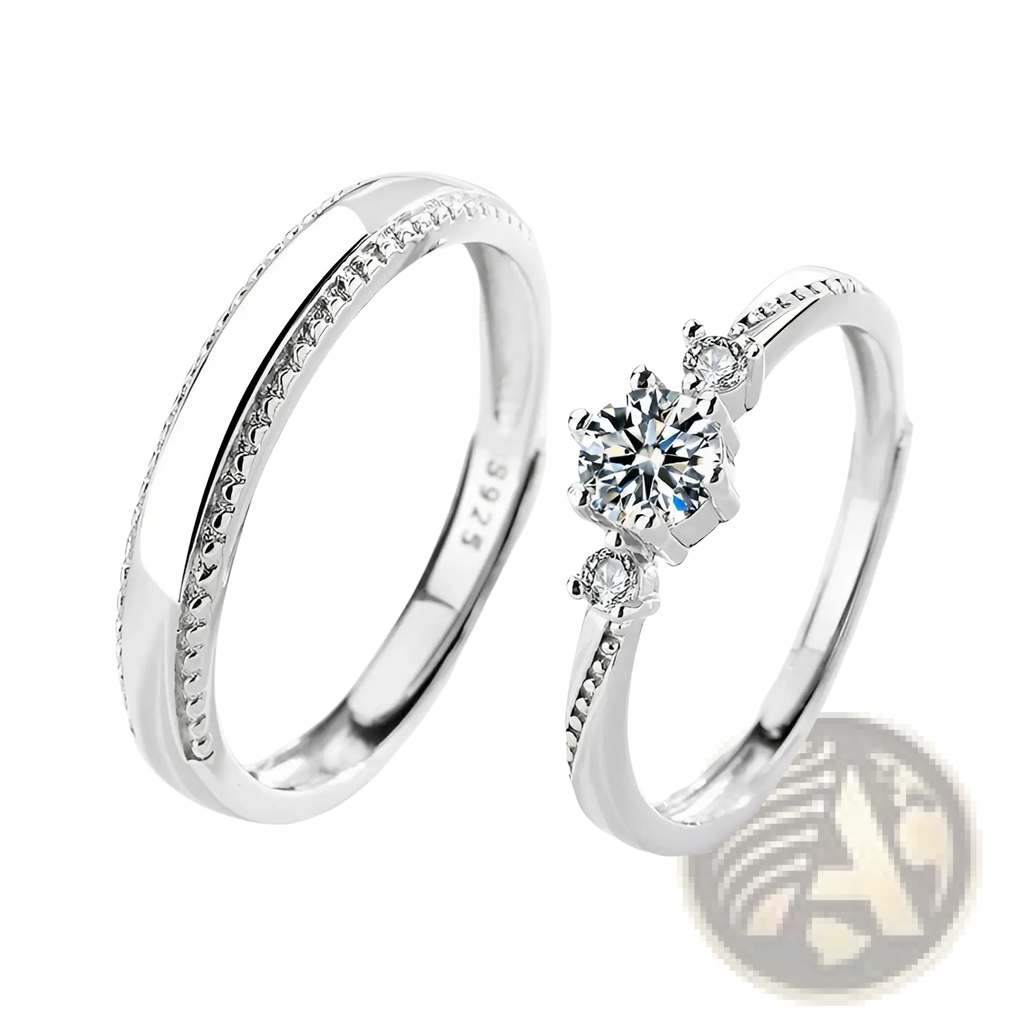 A pair of elegant sterling silver couple rings featuring a diamond cluster and a band with tiny stones