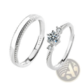 A pair of elegant sterling silver couple rings featuring a diamond cluster and a band with tiny stones