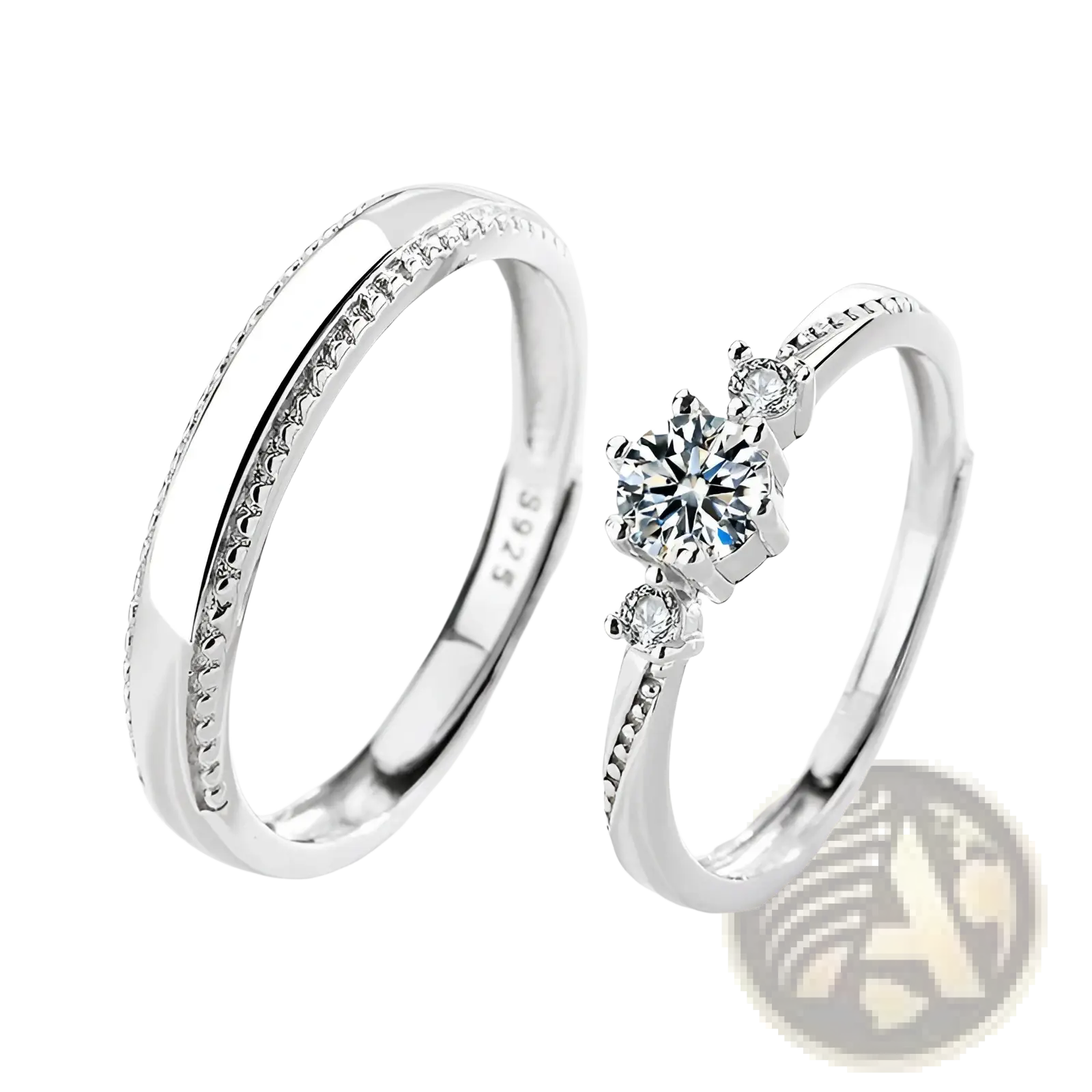 A pair of elegant sterling silver couple rings featuring a diamond cluster and a band with tiny stones