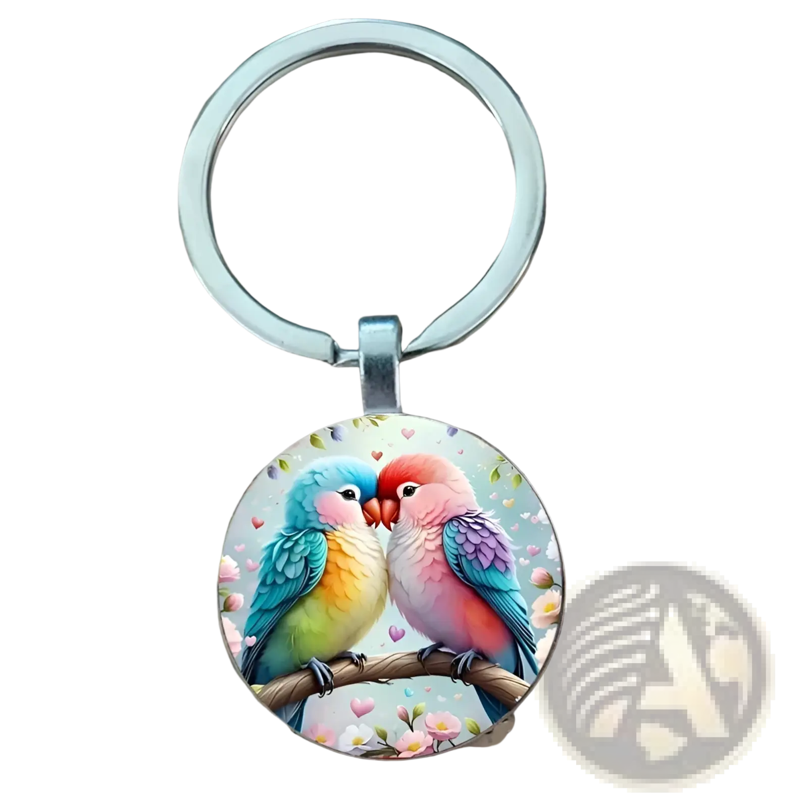 A circular lovebird keychain with two colorful parrots kissing on a branch inside a clear glass dome and silver ring