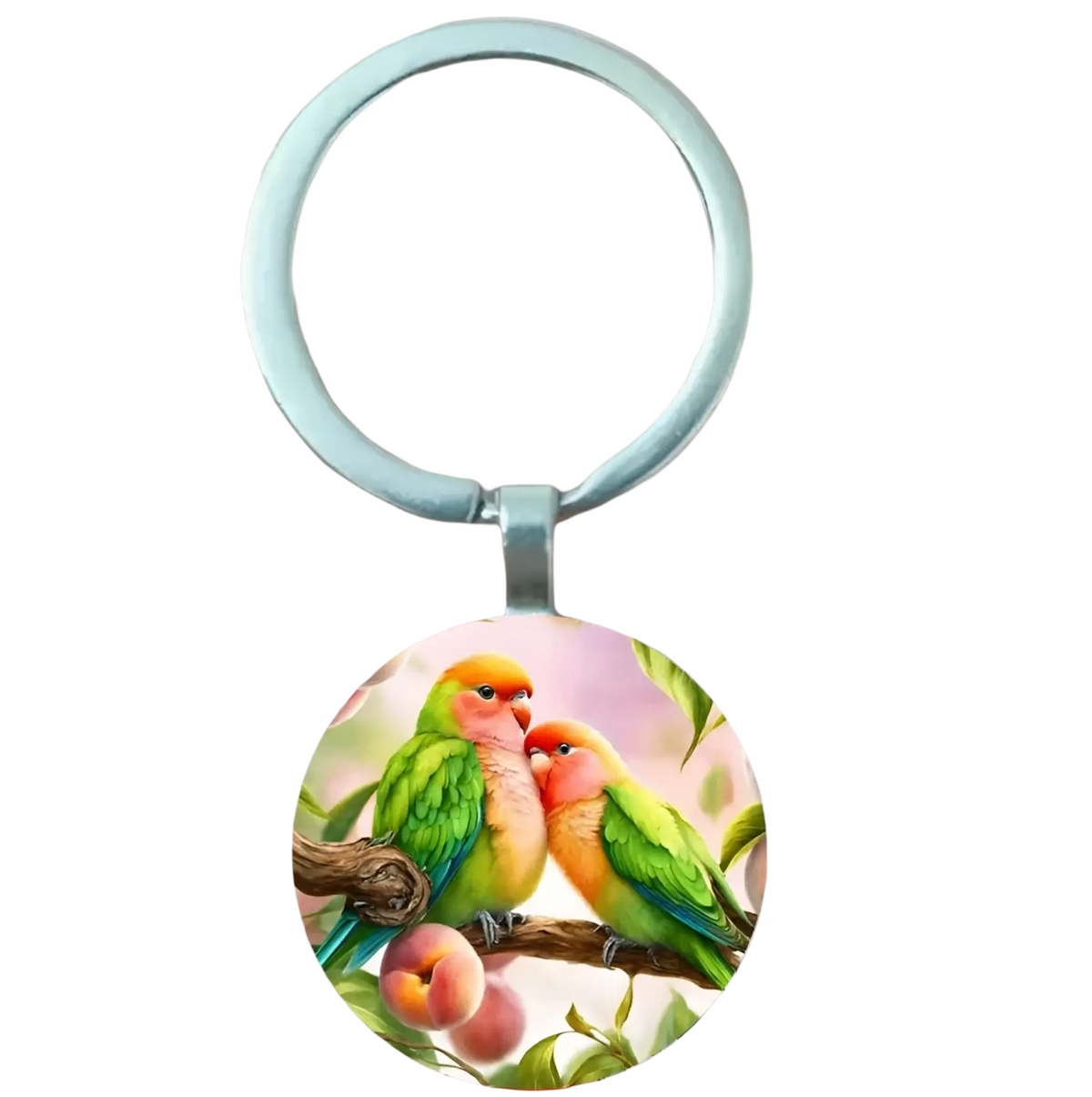 A circular lovebird keychain with green and orange birds on a peach branch in a silver metal ring glass dome