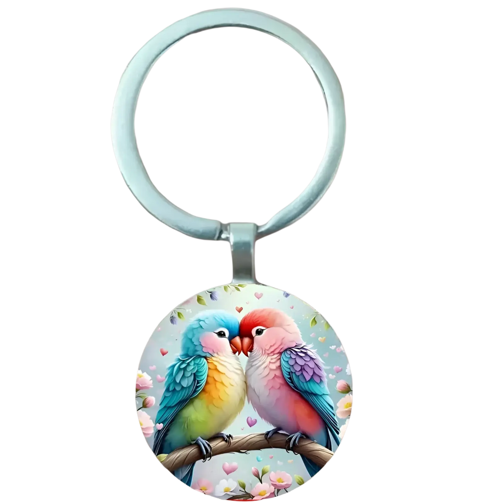 A round colorful glass dome lovebird keychain featuring two affectionate birds on a floral branch with hearts