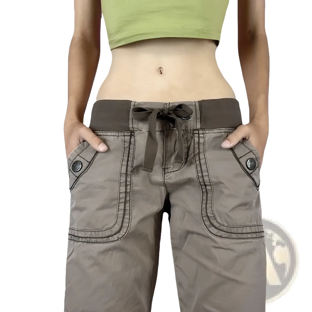 Low waist cargo jeans in beige with dark gray elastic waistband, drawstring, and large front pockets with black buttons
