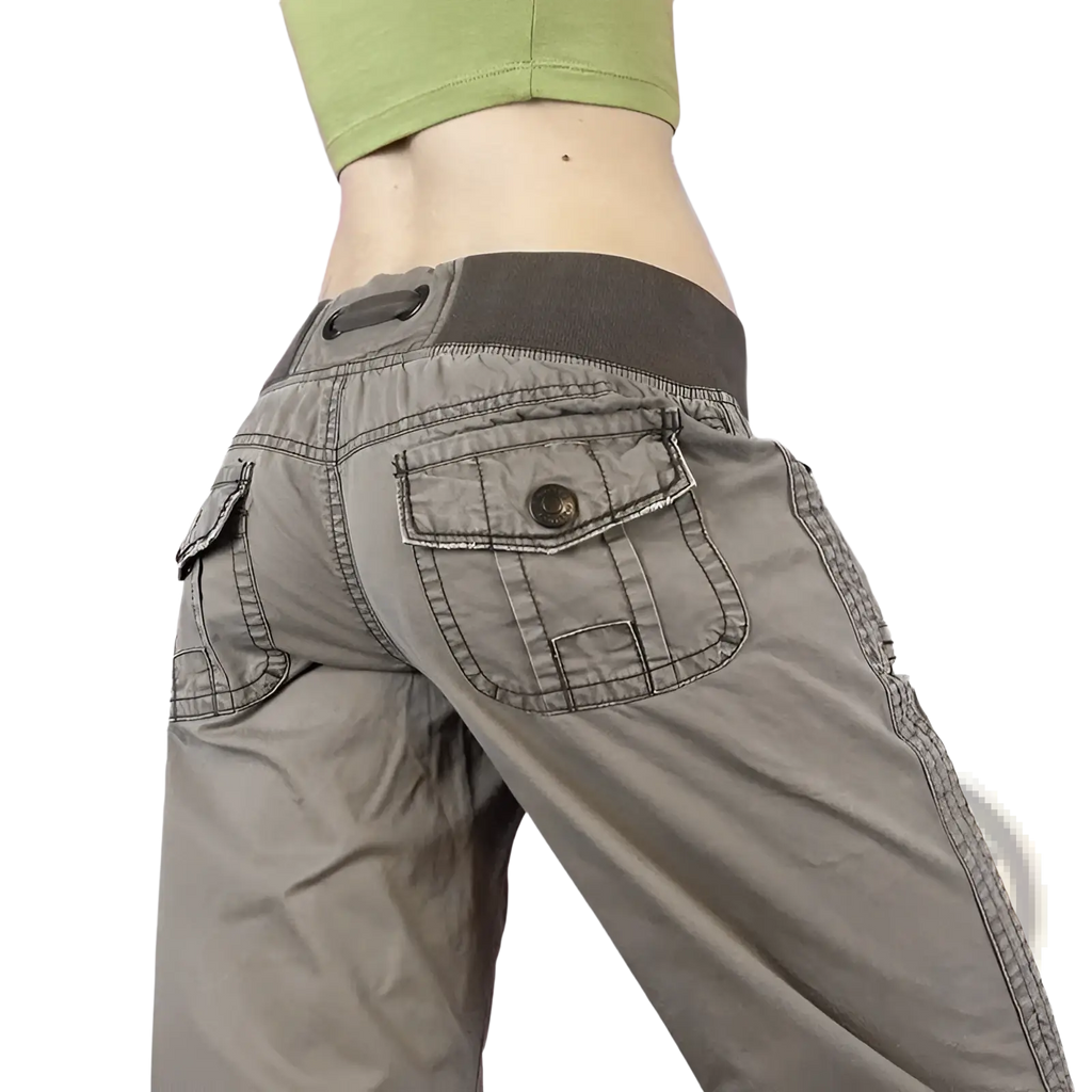 Gray low waist cargo jeans with dark gray elastic waistband and multiple pockets including button closure pocket