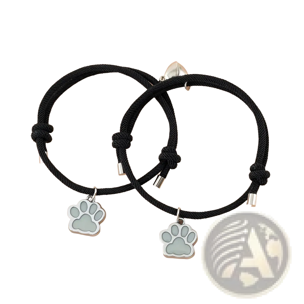 Black cord bracelet with silver paw print charm and metallic clasp from luminous magnetic heart paw print couple bracelets 2pcs