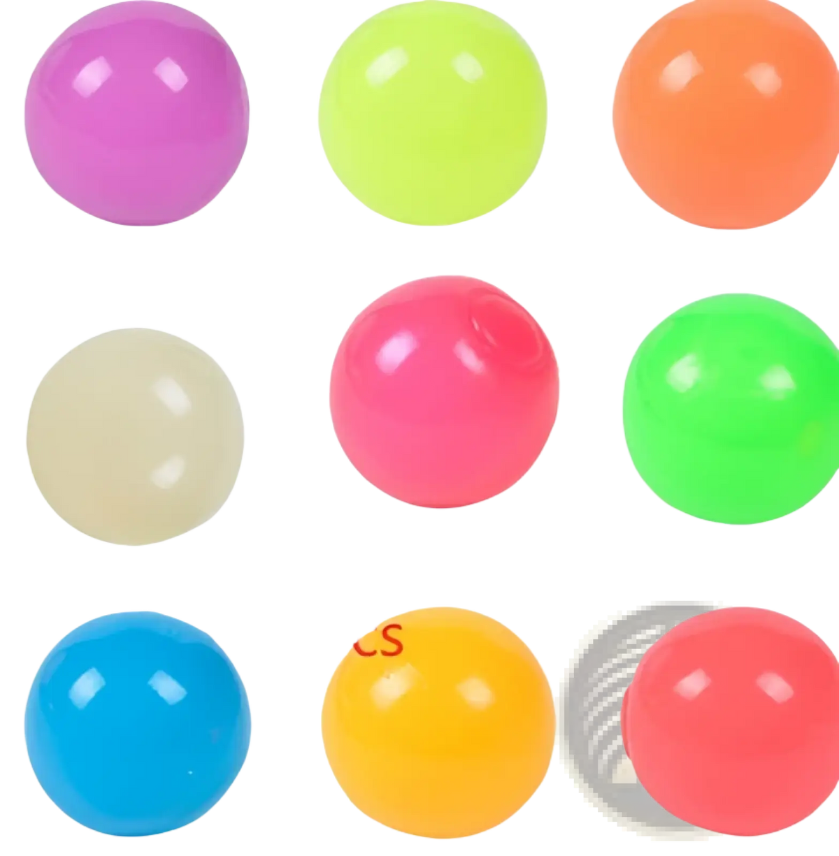 Brightly colored luminous sticky wall balls glow in the dark made of glossy plastic in neon pink green orange blue and yellow