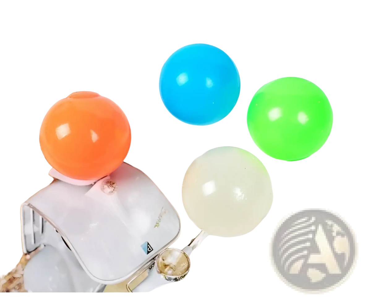 Four colorful 6cm luminous sticky wall balls glow in the dark squeeze toy in orange blue green and clear