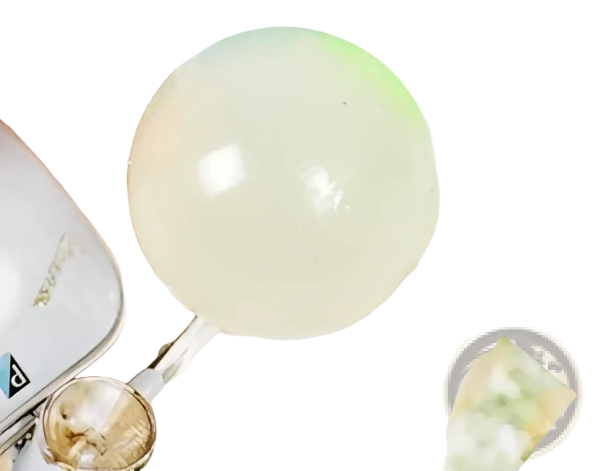 Translucent white spherical beads of luminous sticky wall balls glow in the dark squeeze toy displayed clearly