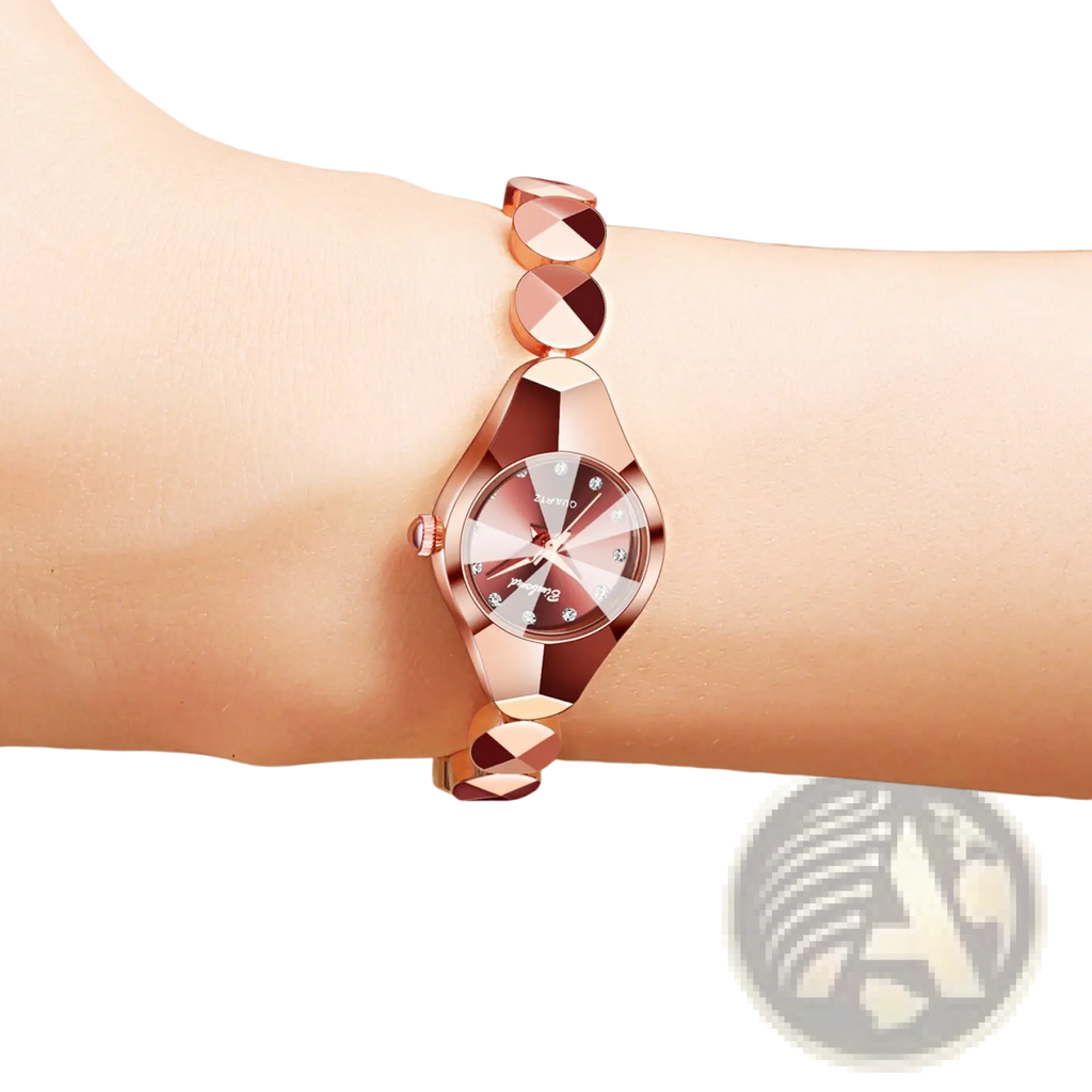 Rose gold geometric bracelet watch with faceted dial and diamond accents in luxe geometric faceted style