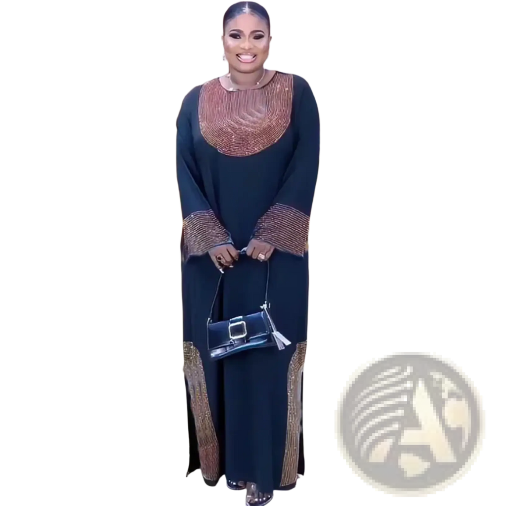 Black mini handbag with silver buckle and tassel detail paired with luxury Dubai abaya beaded evening party dress