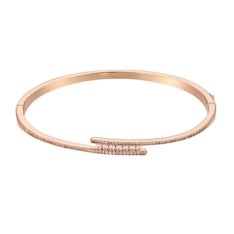 Rose gold luxury gold plated bangle bracelet with clear cubic zirconia stones along the curved edge