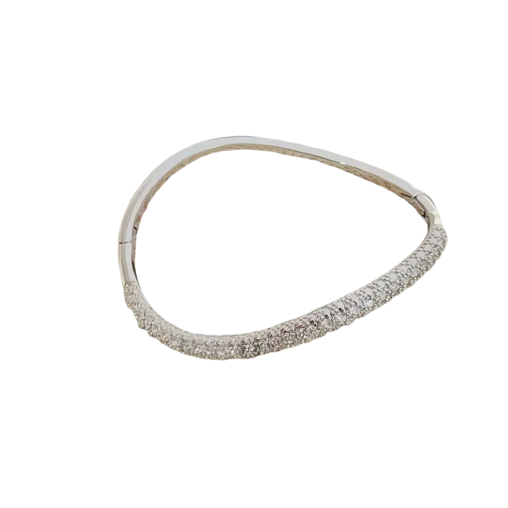 Luxury gold plated bangle bracelet featuring a silver bangle adorned with sparkling clear cubic zirconia crystals