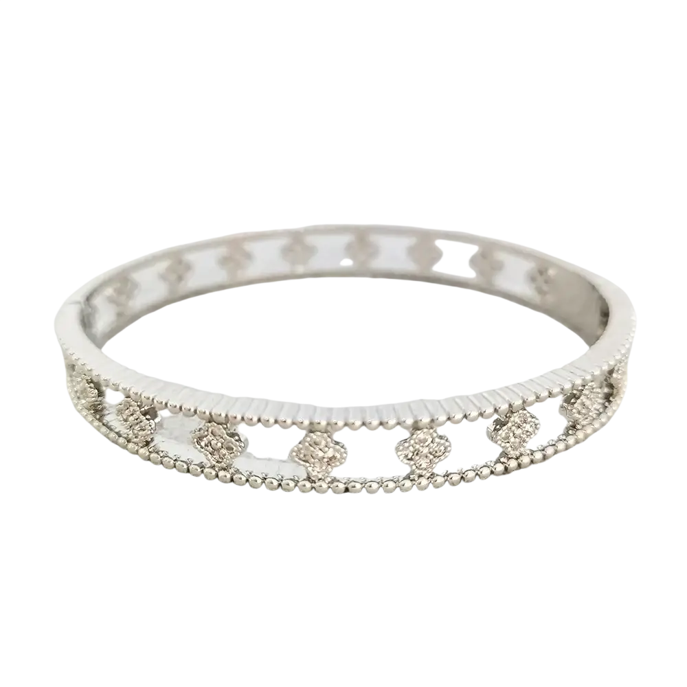 Silver-toned bangle bracelet with intricate floral motifs and beaded edge in luxury gold plated design with cubic zirconia