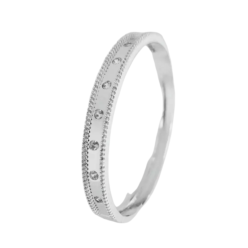A sleek silver bangle bracelet with sparkling cubic zirconia and intricate beaded details luxury gold plated design