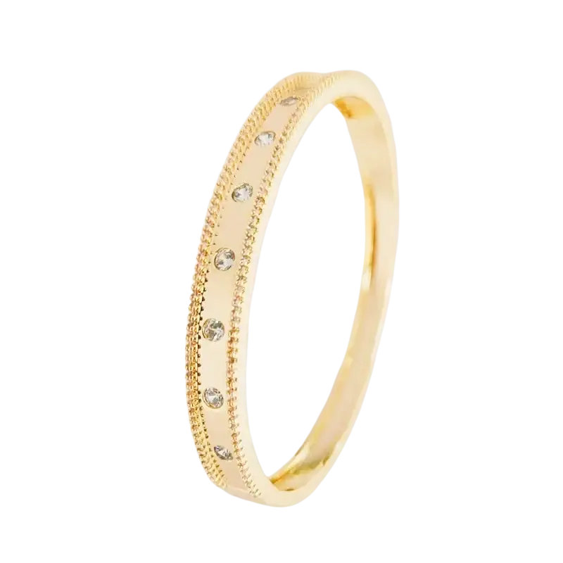 Luxury gold plated bangle bracelet with a delicate beaded edge and five clear cubic zirconia gemstones