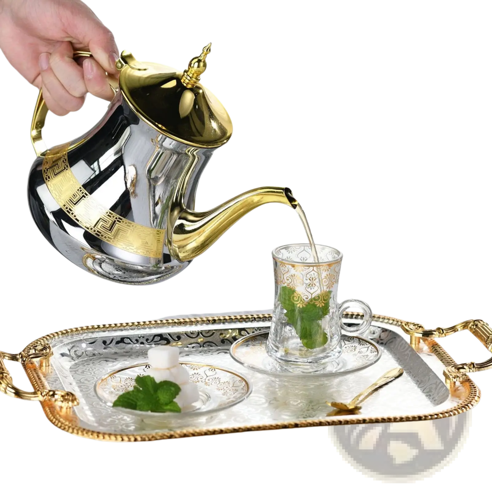 Luxury rectangle serving tray with gold handles holding a shiny silver and gold ornate teapot pouring tea into a matching cup