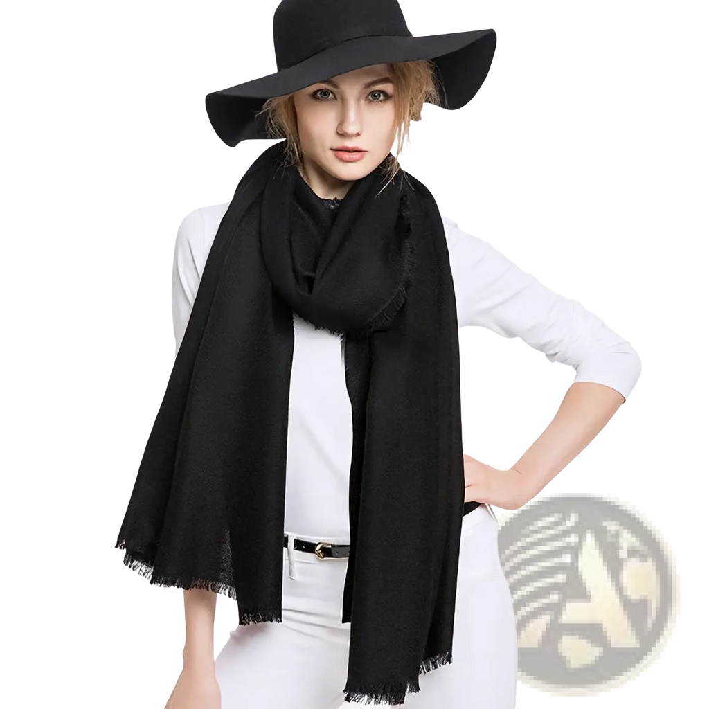 Luxury wool scarf for women in black wool with frayed edges worn elegantly around the neck