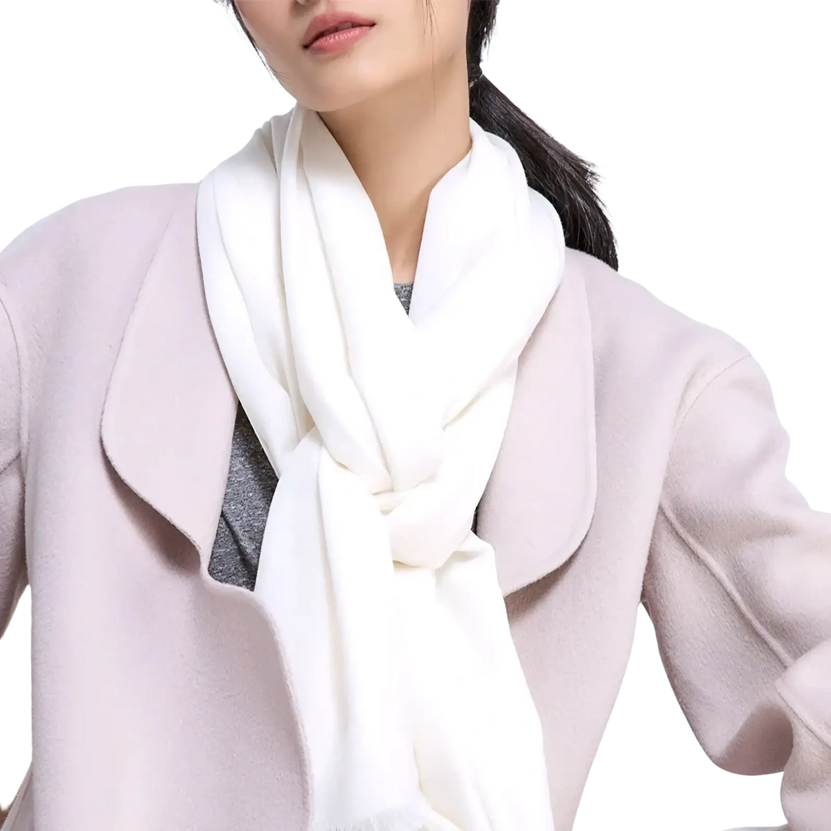 A soft off-white cashmere luxury wool scarf for women elegantly draped around the neck