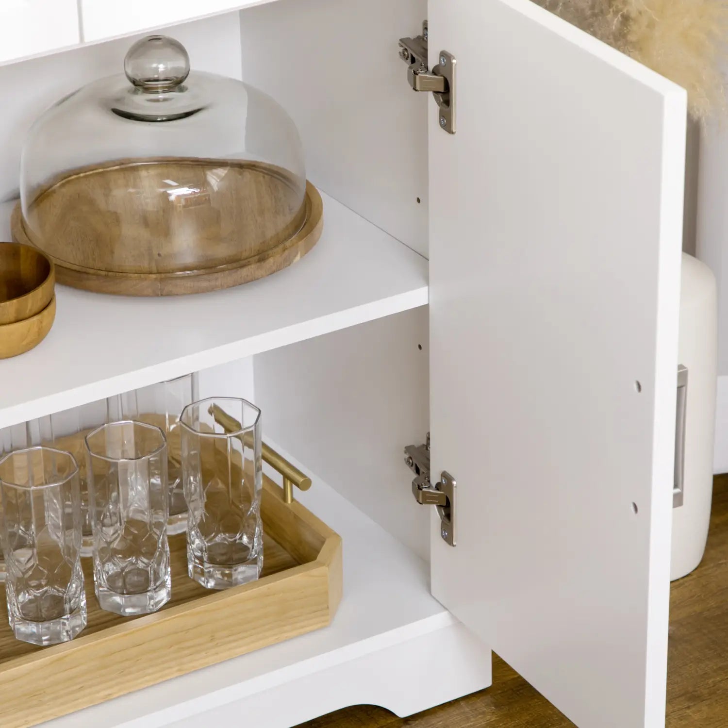 glass cloche with clear glass dome and wooden base displayed on kitchen sideboard buffet cabinet with storage in white oak