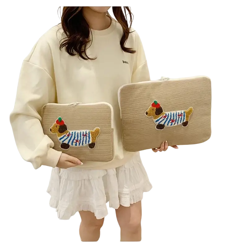 Beige corduroy macbook pro laptop sleeve with embroidered dachshund in striped shirt and red hat design