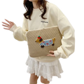 Beige corduroy macbook pro laptop sleeve with colorful embroidered dachshund wearing blue striped sweater and green hat