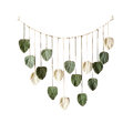 Macrame leaf wall hanging boho decor featuring handcrafted woven leaves in soft green and cream tones on beaded string